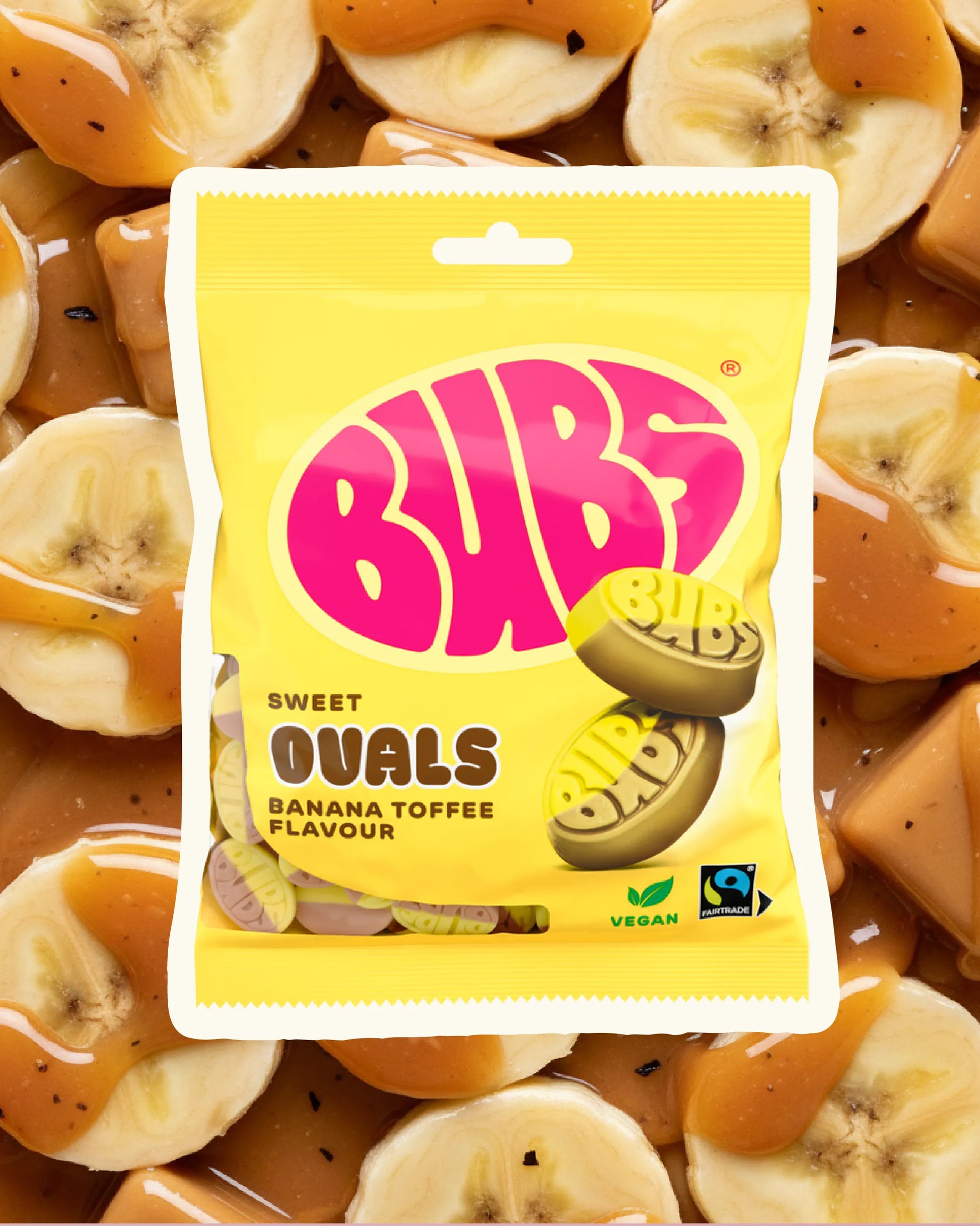 BUBS Swedish vegan candy – Banana Toffee Ovals on a banana and toffee sauce background